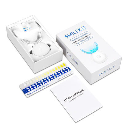 SMILEKIT teeth whitening kit with packaging, LED light, trays, and user manual on a white background.

